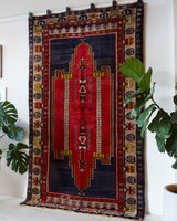 Vintage Turkish rug in a living room setting, pile rug, Turkish rug, vintage rug, portland, rug shop, bright colors, wild shaman, soft rug, bold color, Portland, Oregon, rug store, rug shop, local shop