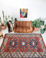 Vintage Turkish rug in living room setting, old rug, antique rug, pastel colors, faded colors, Turkish rug, vintage rug, soft rug, Portland, Oregon, rug store, rug shop, local shop