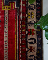Vintage Turkish rug in a living room setting, pile rug, Turkish rug, vintage rug, portland, rug shop, bright colors, wild shaman, soft rug, bold color, Portland, Oregon, rug store, rug shop, local shop