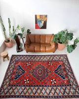 Vintage Turkish rug in a living room setting, pile rug, Turkish rug, vintage rug, portland, rug shop, bright colors, wild shaman, soft rug, bold color, Portland, Oregon, rug store, rug shop, local shop, antique rug