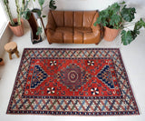 Vintage Turkish rug in a living room setting, pile rug, Turkish rug, vintage rug, portland, rug shop, bright colors, wild shaman, soft rug, bold color, Portland, Oregon, rug store, rug shop, local shop, antique rug