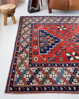 Vintage Turkish rug in a living room setting, pile rug, Turkish rug, vintage rug, portland, rug shop, bright colors, wild shaman, soft rug, bold color, Portland, Oregon, rug store, rug shop, local shop, antique rug