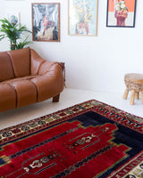 Vintage Turkish rug in a living room setting, pile rug, Turkish rug, vintage rug, portland, rug shop, bright colors, wild shaman, soft rug, bold color, Portland, Oregon, rug store, rug shop, local shop