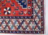 Vintage Turkish rug in a living room setting, pile rug, Turkish rug, vintage rug, portland, rug shop, bright colors, wild shaman, soft rug, bold color, Portland, Oregon, rug store, rug shop, local shop, antique rug