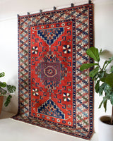 Vintage Turkish rug in a living room setting, pile rug, Turkish rug, vintage rug, portland, rug shop, bright colors, wild shaman, soft rug, bold color, Portland, Oregon, rug store, rug shop, local shop, antique rug