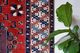 Vintage Turkish rug in a living room setting, pile rug, Turkish rug, vintage rug, portland, rug shop, bright colors, wild shaman, soft rug, bold color, Portland, Oregon, rug store, rug shop, local shop, antique rug