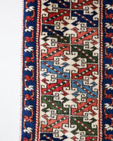 Vintage Turkish rug in a living room setting, pile rug, Turkish rug, vintage rug, portland, rug shop, bright colors, wild shaman, soft rug, bold color, Portland, Oregon, rug store, rug shop, local shop, antique rug