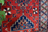 Vintage Turkish rug in a living room setting, pile rug, Turkish rug, vintage rug, portland, rug shop, bright colors, wild shaman, soft rug, bold color, Portland, Oregon, rug store, rug shop, local shop, antique rug