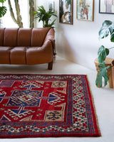 Vintage Turkish rug in a living room setting, pile rug, Turkish rug, vintage rug, portland, rug shop, bright colors, wild shaman, soft rug, bold color, Portland, Oregon, rug store, rug shop, local shop