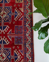 Vintage Turkish rug in a living room setting, pile rug, Turkish rug, vintage rug, portland, rug shop, bright colors, wild shaman, soft rug, bold color, Portland, Oregon, rug store, rug shop, local shop