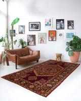 Vintage Turkish rug in a living room setting, pile rug, Turkish rug, vintage rug, portland, rug shop, bright colors, wild shaman, soft rug, bold color, Portland, Oregon, rug store, rug shop, local shop