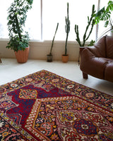 Vintage Turkish rug in a living room setting, pile rug, Turkish rug, vintage rug, portland, rug shop, bright colors, wild shaman, soft rug, bold color, Portland, Oregon, rug store, rug shop, local shop