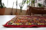 Vintage Turkish rug in a living room setting, pile rug, Turkish rug, vintage rug, portland, rug shop, bright colors, wild shaman, soft rug, bold color, Portland, Oregon, rug store, rug shop, local shop