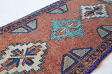 Vintage Turkish mini rug in room decor setting, old rug, antique rug, pastel colors, faded colors, Turkish rug, vintage rug, soft rug, Portland, Oregon, rug store, rug shop, local shop