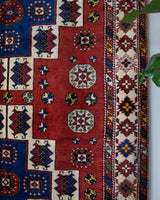 Vintage Turkish rug in a living room setting, pile rug, Turkish rug, vintage rug, portland, rug shop, bright colors, wild shaman, soft rug, bold color, Portland, Oregon, rug store, rug shop, local shop