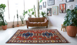 Vintage Turkish rug in a living room setting, pile rug, Turkish rug, vintage rug, portland, rug shop, bright colors, wild shaman, soft rug, bold color, Portland, Oregon, rug store, rug shop, local shop