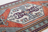 Vintage Turkish mini rug in room decor setting, old rug, antique rug, pastel colors, faded colors, Turkish rug, vintage rug, soft rug, Portland, Oregon, rug store, rug shop, local shop