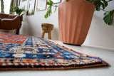 Vintage Turkish rug in a living room setting, pile rug, Turkish rug, vintage rug, portland, rug shop, bright colors, wild shaman, soft rug, bold color, Portland, Oregon, rug store, rug shop, local shop