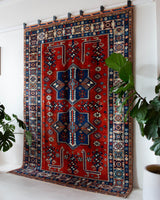 Vintage Turkish rug in a living room setting, pile rug, Turkish rug, vintage rug, portland, rug shop, bright colors, wild shaman, soft rug, bold color, Portland, Oregon, rug store, rug shop, local shop