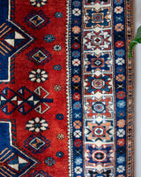 Vintage Turkish rug in a living room setting, pile rug, Turkish rug, vintage rug, portland, rug shop, bright colors, wild shaman, soft rug, bold color, Portland, Oregon, rug store, rug shop, local shop