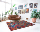 Vintage Turkish rug in a living room setting, pile rug, Turkish rug, vintage rug, portland, rug shop, bright colors, wild shaman, soft rug, bold color, Portland, Oregon, rug store, rug shop, local shop