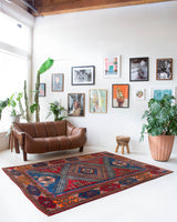 Vintage Turkish rug in a living room setting, pile rug, Turkish rug, vintage rug, portland, rug shop, bright colors, wild shaman, soft rug, bold color, Portland, Oregon, rug store, rug shop, local shop