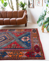 Vintage Turkish rug in a living room setting, pile rug, Turkish rug, vintage rug, portland, rug shop, bright colors, wild shaman, soft rug, bold color, Portland, Oregon, rug store, rug shop, local shop