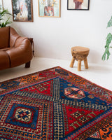 Vintage Turkish rug in a living room setting, pile rug, Turkish rug, vintage rug, portland, rug shop, bright colors, wild shaman, soft rug, bold color, Portland, Oregon, rug store, rug shop, local shop