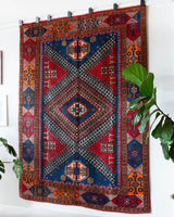 Vintage Turkish rug in a living room setting, pile rug, Turkish rug, vintage rug, portland, rug shop, bright colors, wild shaman, soft rug, bold color, Portland, Oregon, rug store, rug shop, local shop