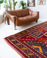 Vintage Turkish rug in a living room setting, pile rug, Turkish rug, vintage rug, portland, rug shop, bright colors, wild shaman, soft rug, bold color, Portland, Oregon, rug store, rug shop, local shop