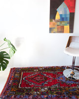 Vintage Turkish runner rug in living room setting, old rug, antique rug, pastel colors, faded colors, Turkish rug, vintage rug, soft rug, Portland, Oregon, rug store, rug shop, local shop