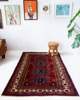 Vintage Turkish rug in a living room setting, pile rug, Turkish rug, vintage rug, portland, rug shop, bright colors, wild shaman, soft rug, bold color, Portland, Oregon, rug store, rug shop, local shop