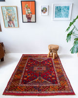 Vintage Turkish rug in a living room setting, pile rug, Turkish rug, vintage rug, portland, rug shop, bright colors, wild shaman, soft rug, bold color, Portland, Oregon, rug store, rug shop, local shop