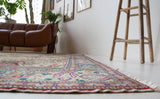 Vintage Turkish rug in living room setting, old rug, antique rug, pastel colors, faded colors, Turkish rug, vintage rug, soft rug, Portland, Oregon, rug store, rug shop, local shop