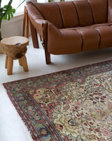 Vintage Turkish rug in living room setting, old rug, antique rug, pastel colors, faded colors, Turkish rug, vintage rug, soft rug, Portland, Oregon, rug store, rug shop, local shop