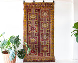 Vintage Turkish rug in a living room setting, pile rug, Turkish rug, vintage rug, portland, rug shop, bright colors, wild shaman, soft rug, bold color, Portland, Oregon, rug store, rug shop, local shop, antique rug, distressed rug, worn out rug