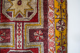 Vintage Turkish rug in a living room setting, pile rug, Turkish rug, vintage rug, portland, rug shop, bright colors, wild shaman, soft rug, bold color, Portland, Oregon, rug store, rug shop, local shop, antique rug, distressed rug, worn out rug