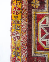 Vintage Turkish rug in a living room setting, pile rug, Turkish rug, vintage rug, portland, rug shop, bright colors, wild shaman, soft rug, bold color, Portland, Oregon, rug store, rug shop, local shop, antique rug, distressed rug, worn out rug