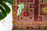 Vintage Turkish rug in a living room setting, pile rug, Turkish rug, vintage rug, portland, rug shop, bright colors, wild shaman, soft rug, bold color, Portland, Oregon, rug store, rug shop, local shop, antique rug, distressed rug, worn out rug