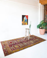 Vintage Turkish rug in a living room setting, pile rug, Turkish rug, vintage rug, portland, rug shop, bright colors, wild shaman, soft rug, bold color, Portland, Oregon, rug store, rug shop, local shop, antique rug, distressed rug, worn out rug