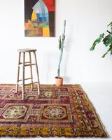 Vintage Turkish rug in a living room setting, pile rug, Turkish rug, vintage rug, portland, rug shop, bright colors, wild shaman, soft rug, bold color, Portland, Oregon, rug store, rug shop, local shop, antique rug, distressed rug, worn out rug
