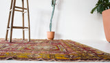 Vintage Turkish rug in a living room setting, pile rug, Turkish rug, vintage rug, portland, rug shop, bright colors, wild shaman, soft rug, bold color, Portland, Oregon, rug store, rug shop, local shop, antique rug, distressed rug, worn out rug