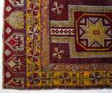 Vintage Turkish rug in a living room setting, pile rug, Turkish rug, vintage rug, portland, rug shop, bright colors, wild shaman, soft rug, bold color, Portland, Oregon, rug store, rug shop, local shop, antique rug, distressed rug, worn out rug