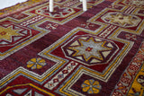 Vintage Turkish rug in a living room setting, pile rug, Turkish rug, vintage rug, portland, rug shop, bright colors, wild shaman, soft rug, bold color, Portland, Oregon, rug store, rug shop, local shop, antique rug, distressed rug, worn out rug