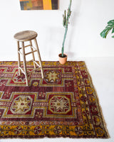 Vintage Turkish rug in a living room setting, pile rug, Turkish rug, vintage rug, portland, rug shop, bright colors, wild shaman, soft rug, bold color, Portland, Oregon, rug store, rug shop, local shop, antique rug, distressed rug, worn out rug
