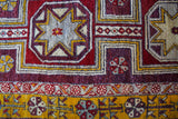 Vintage Turkish rug in a living room setting, pile rug, Turkish rug, vintage rug, portland, rug shop, bright colors, wild shaman, soft rug, bold color, Portland, Oregon, rug store, rug shop, local shop, antique rug, distressed rug, worn out rug