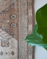 Vintage Turkish runner rug in living room setting, old rug, antique rug, pastel colors, faded colors, Turkish rug, vintage rug, soft rug, Portland, Oregon, rug store, rug shop, local shop