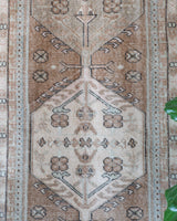 Vintage Turkish runner rug in living room setting, old rug, antique rug, pastel colors, faded colors, Turkish rug, vintage rug, soft rug, Portland, Oregon, rug store, rug shop, local shop