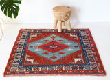 Vintage Turkish rug in a living room setting, pile rug, Turkish rug, vintage rug, portland, rug shop, bright colors, wild shaman, soft rug, bold color, Portland, Oregon, rug store, rug shop, local shop, antique rug