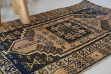 Vintage Turkish mini rug in room decor setting, old rug, antique rug, pastel colors, faded colors, Turkish rug, vintage rug, soft rug, Portland, Oregon, rug store, rug shop, local shop